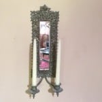 Antique wall sconce with candles